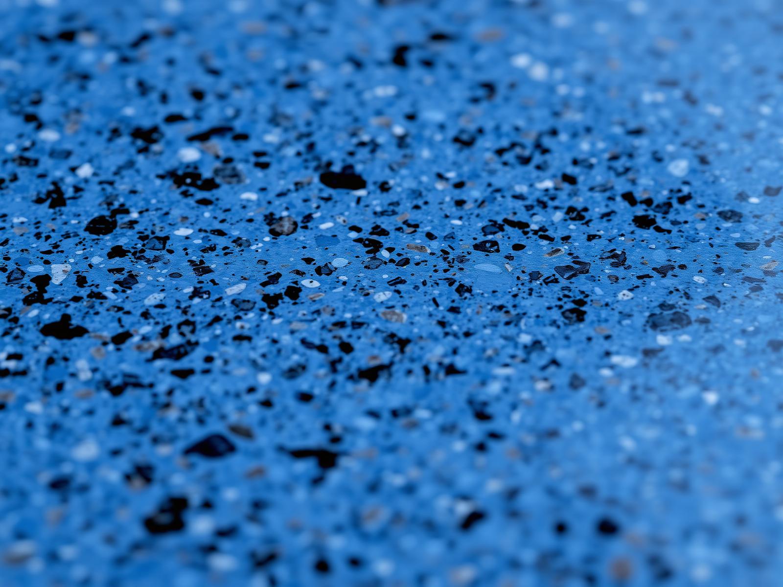 Detalhe macro do acabamento Granitada em azul profundo